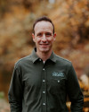 picture of Dr. Vinnie Cappetta standing in front of trees